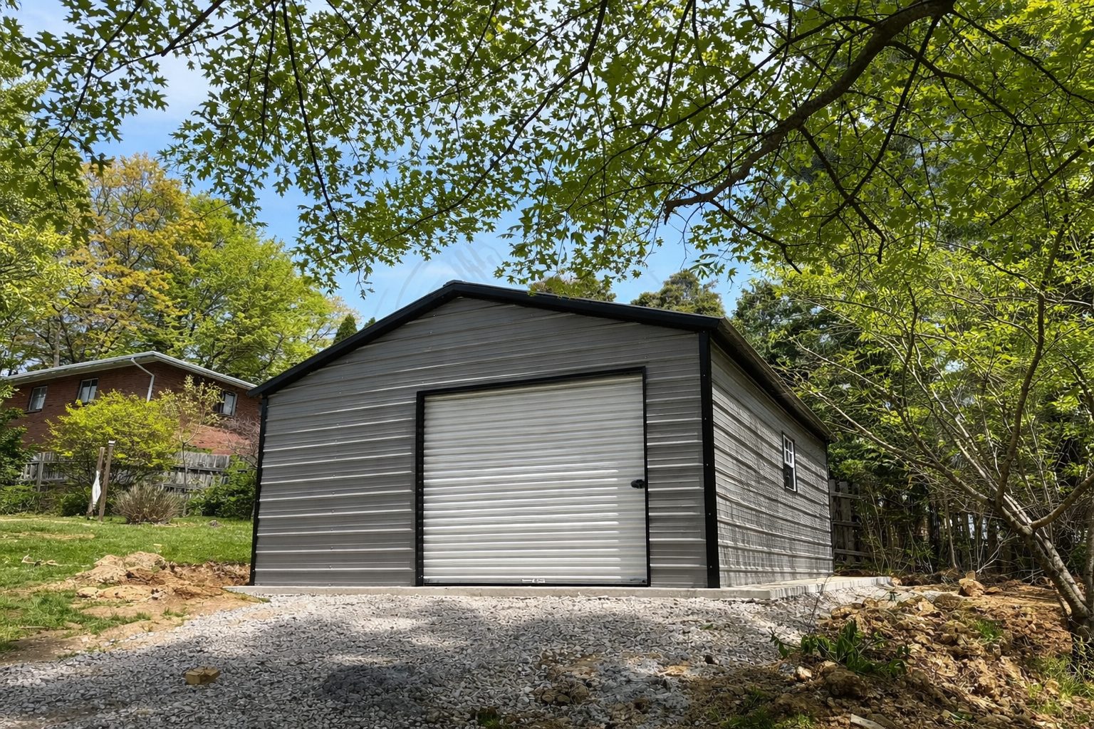 Standard shed in Abbott, TX, featuring a metal exterior and a roll-up door, surrounded by greenery.