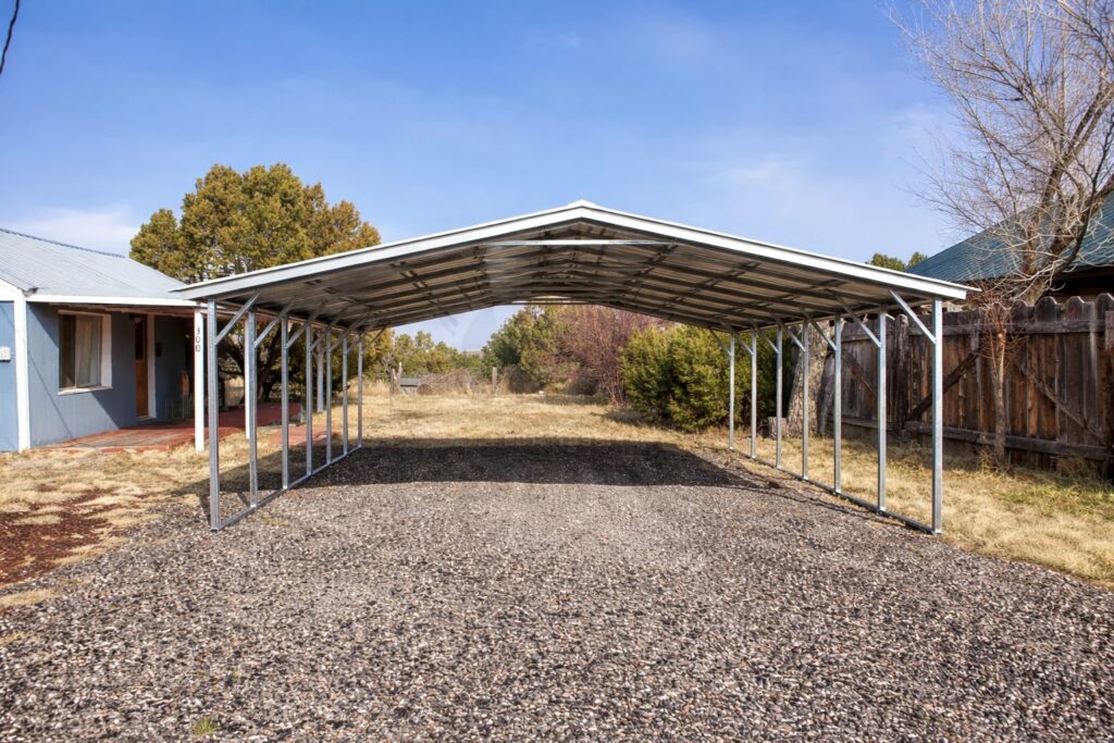 A spacious A-framed carport with a metal roof, set in a grassy area in Ann Arbor, MI.