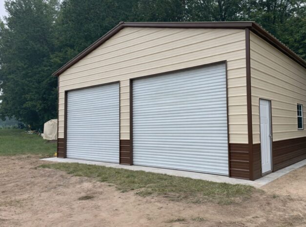 Standard garage building in Atlanta, TX, featuring two large roll-up doors and a beige and brown exterior.
