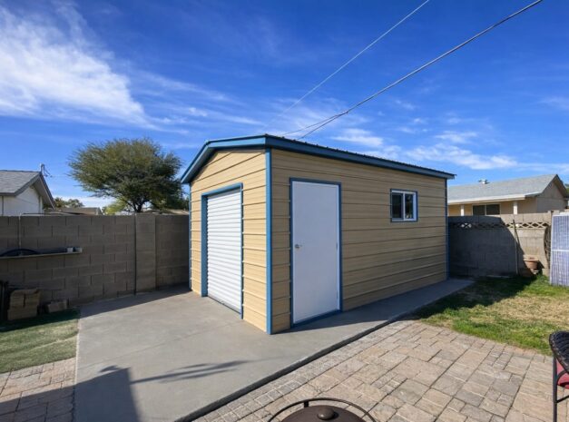 A mini shed in Brady, TX, featuring a light-colored exterior, blue trim, and a front door, set in a backyard.