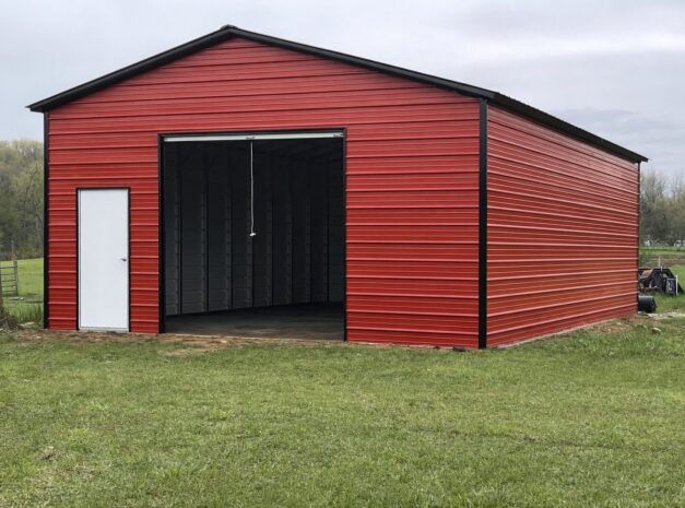 A red standard shed in Brownwood, TX, showcasing a spacious design with a side door and open front.