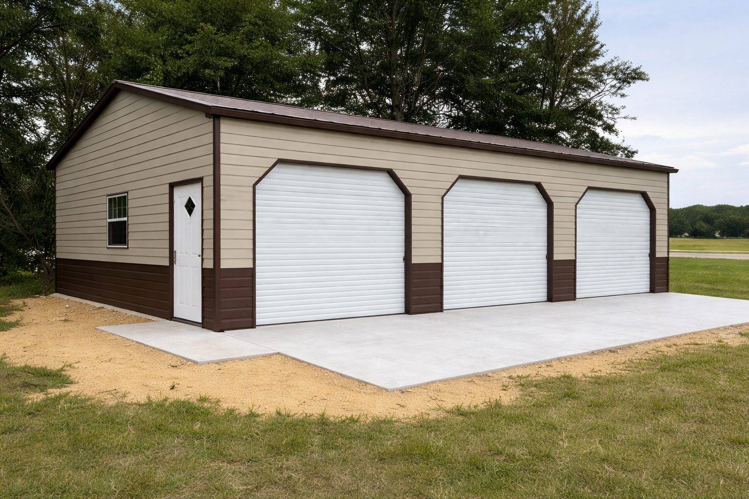 Expansive garage with three roll-up doors and a concrete pad, surrounded by grass and trees in Canton, OH.