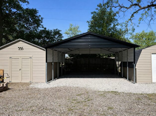 A-frame carport with two storage sheds on either side, surrounded by gravel and trees in Chandler, AZ.