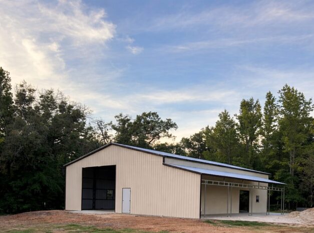 Modified clear span building in Cincinnati, showcasing a beige exterior and large windows.