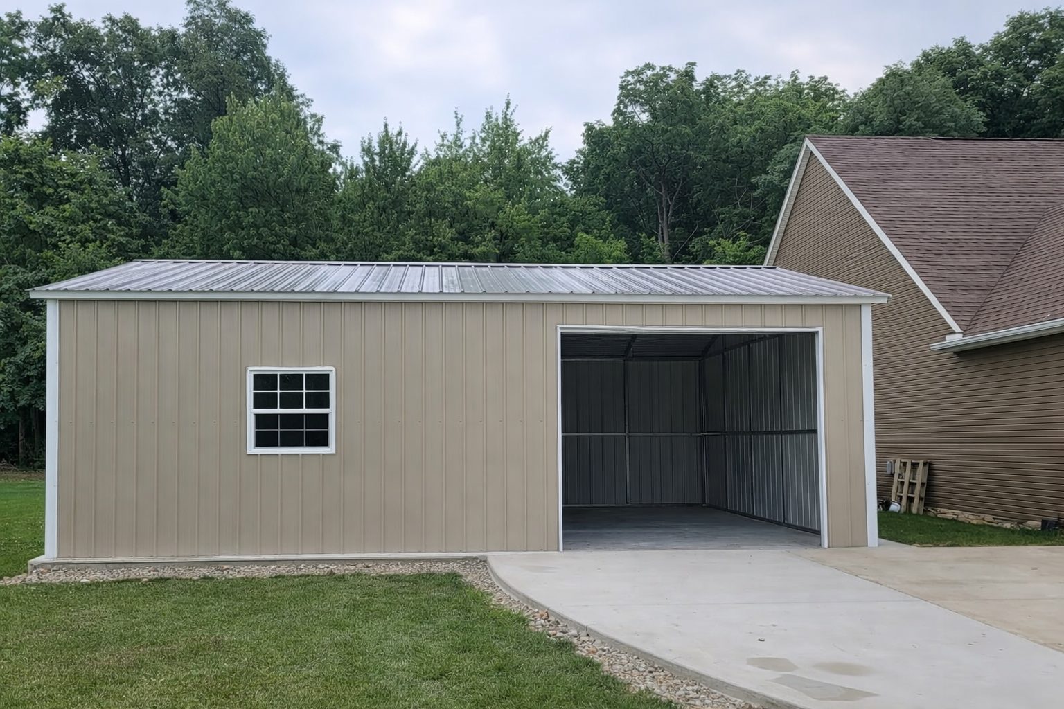 Standard garage structure in Cockrell Hill, TX, featuring a metal exterior and a spacious open bay.