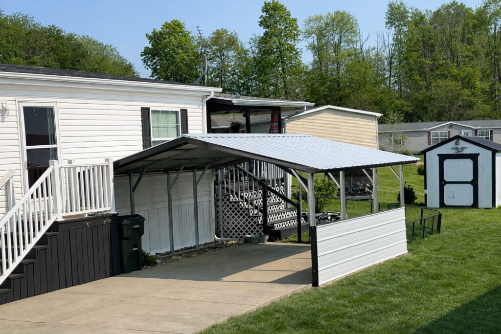 A-frame carport in Douglas, AZ, providing shelter for vehicles next to a home and yard.