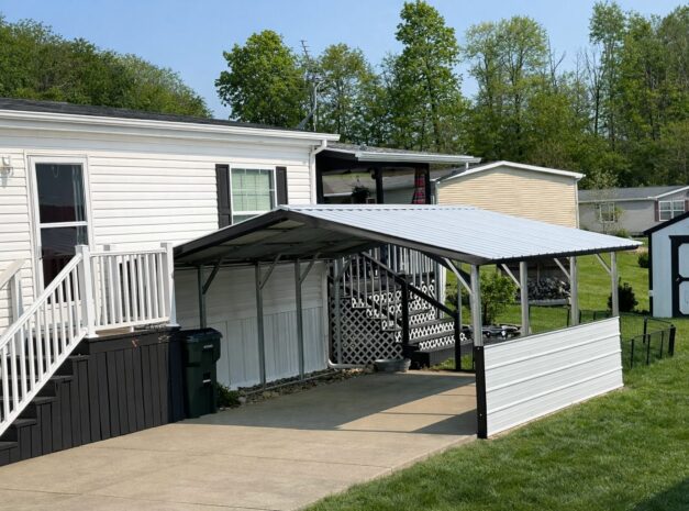A-frame carport in Douglas, AZ, providing shelter for vehicles next to a home and yard.