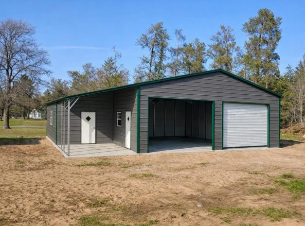 Custom garage in Duluth MN featuring a gray exterior, green trim, and a large roll-up door.