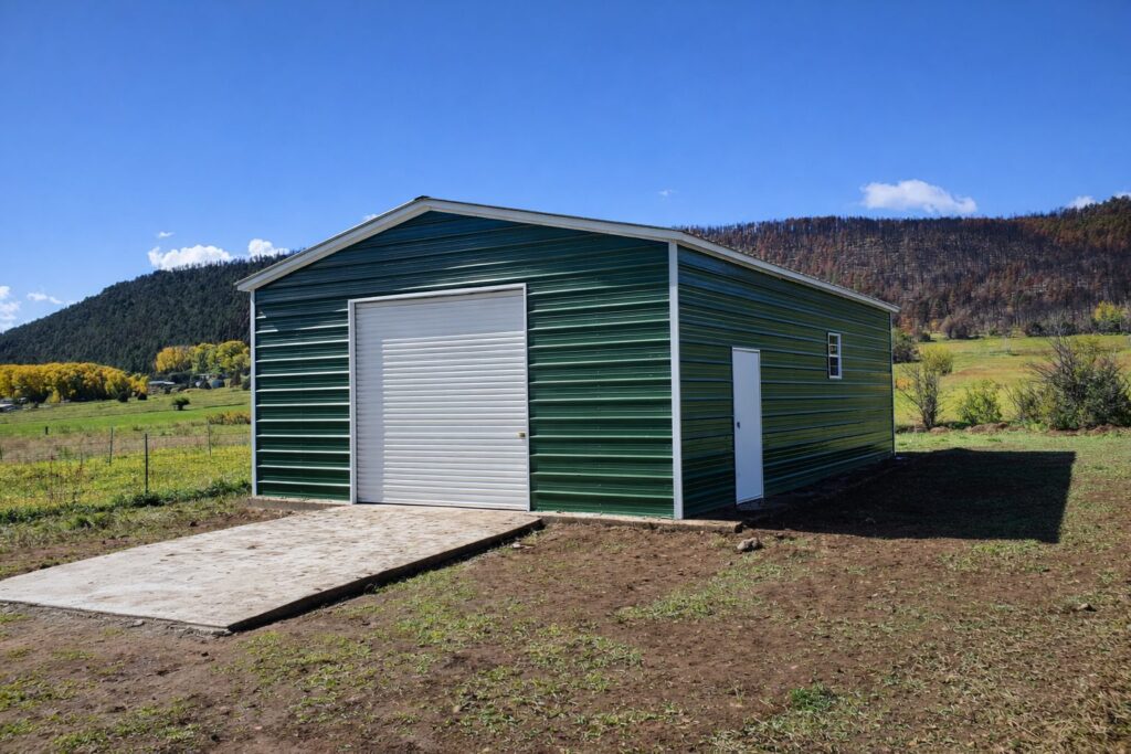 Green standard garage with a large door, set against a scenic landscape in Flint, MI.