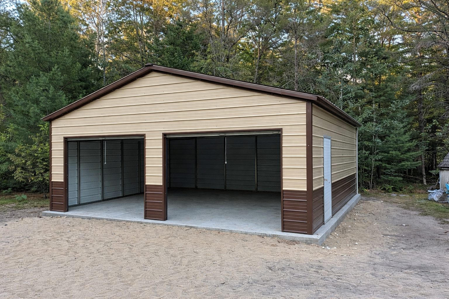 Standard garage structure in Garland, TX, featuring a beige exterior and two large garage doors.