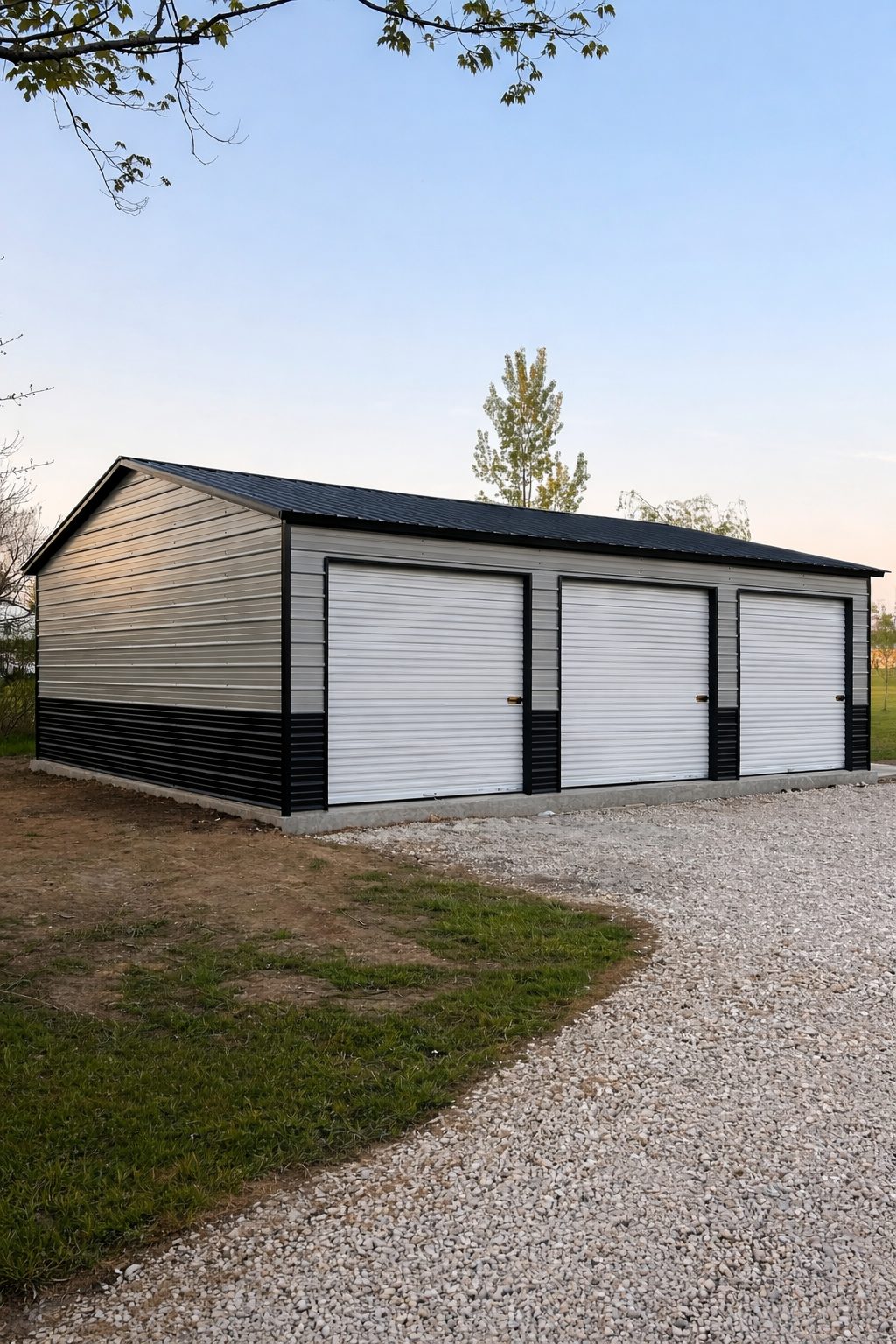 Expansive garage in Glen Rose, TX, featuring three roll-up doors and a sleek black and silver design.