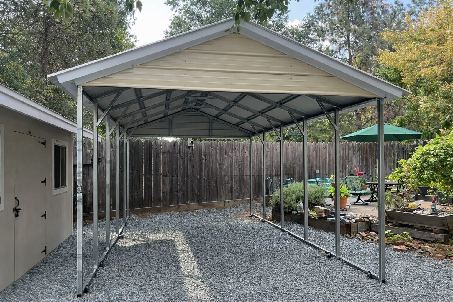 A-frame carport with a metal frame and roof, set in a gravel area surrounded by greenery in Grand Prairie, TX.