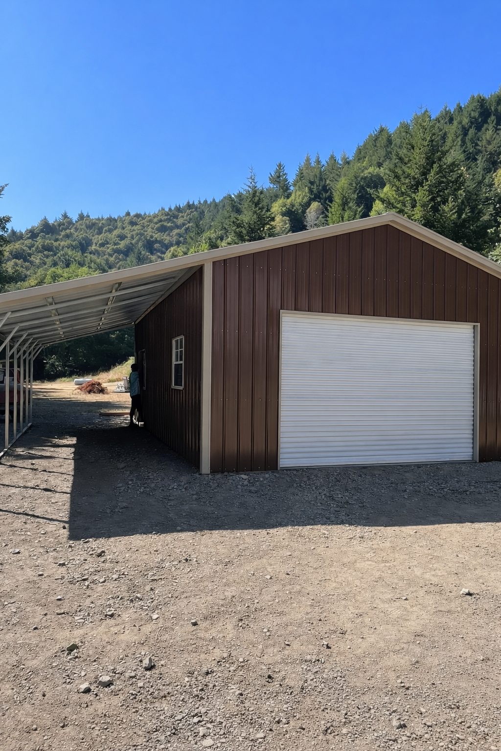 Custom carport structure in Grapevine, TX, featuring a metal exterior and a large garage door.