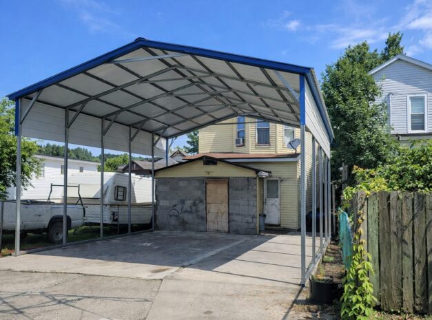 A-frame carport in Hopkinsville KY, showcasing a spacious design with a blue roof and open sides.