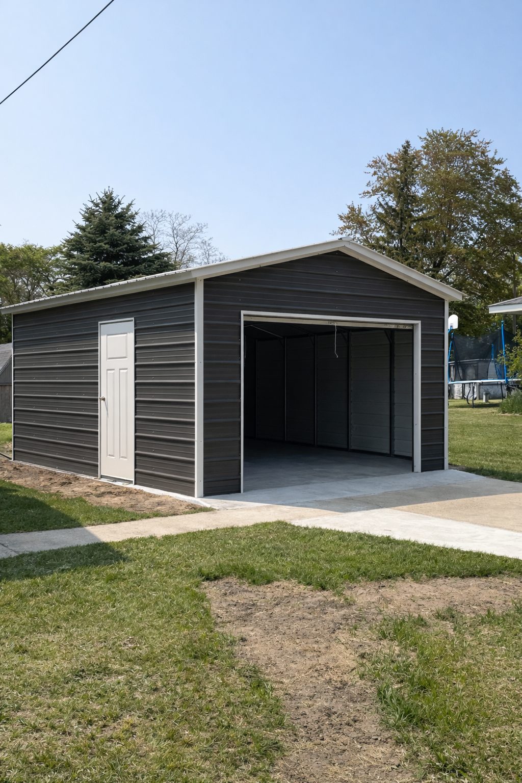 Mini shed in Ladonia TX with a gray exterior and a single door, set on a concrete slab in a grassy area.
