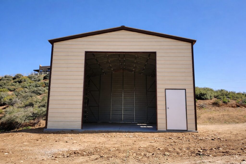 A-frame carport with a large open entrance, showcasing its spacious interior and metal construction.