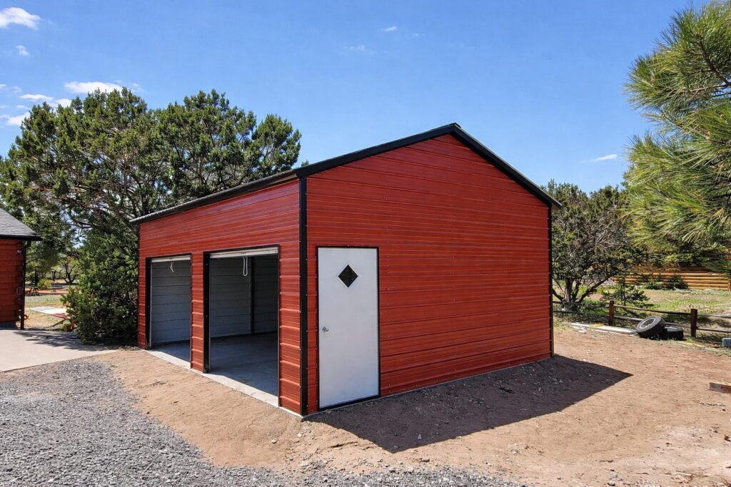 Standard garage in Maryville, MO, featuring a red exterior and two garage doors, surrounded by landscaping.
