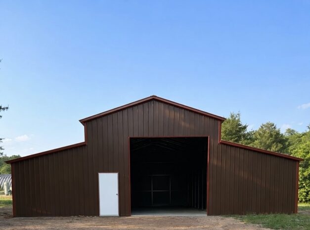 Traditional barn structure in Newark, OH, featuring a brown exterior and large open entrance.