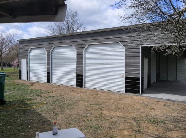 Expansive garage in Standish, MI, featuring multiple roll-up doors and a concrete foundation.