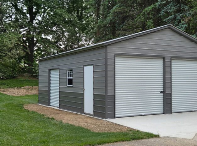 Standard garage in Appleton, WI, featuring a gray metal exterior and two roll-up doors.