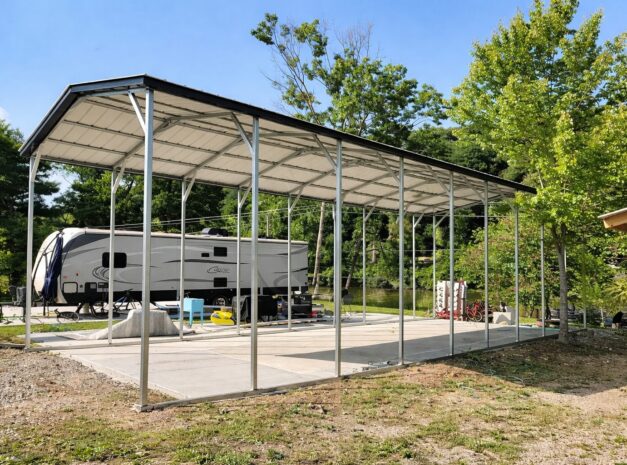 A-frame carport in Waco, TX, providing shelter for an RV, surrounded by trees and outdoor space.